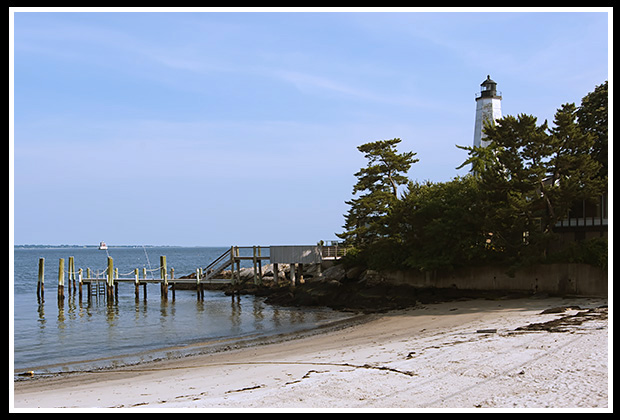 View of New London Harbor lighthouse from the beach
