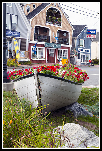 boat full of flowers by artist community in Lincolnville