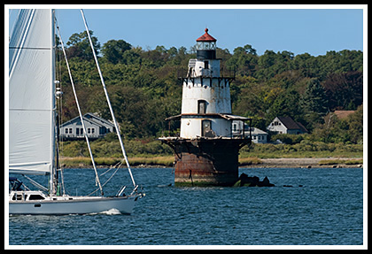 sailboat approaches Hog Island Shoal Light